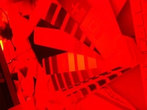 View through red anaglyph glasses on red pantone colours